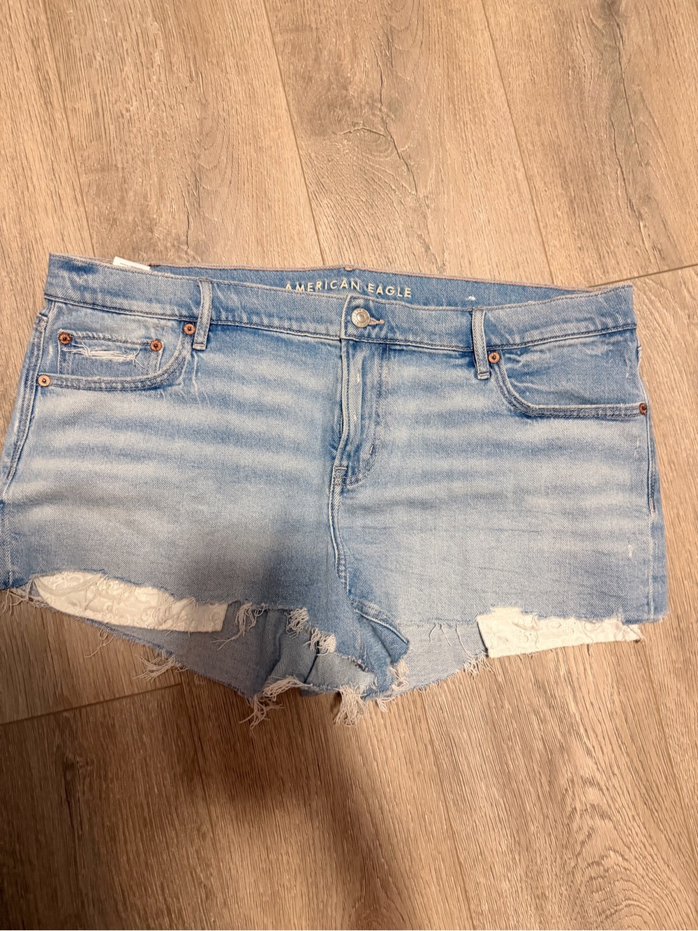 American Eagle Outfitters Light Wash Denim Lace-Trim Cutoff Shorts